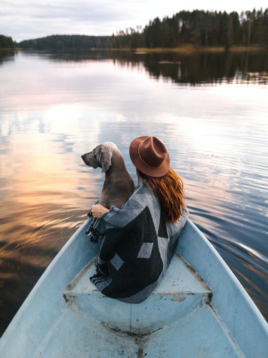 Girl With Dog In A Boat